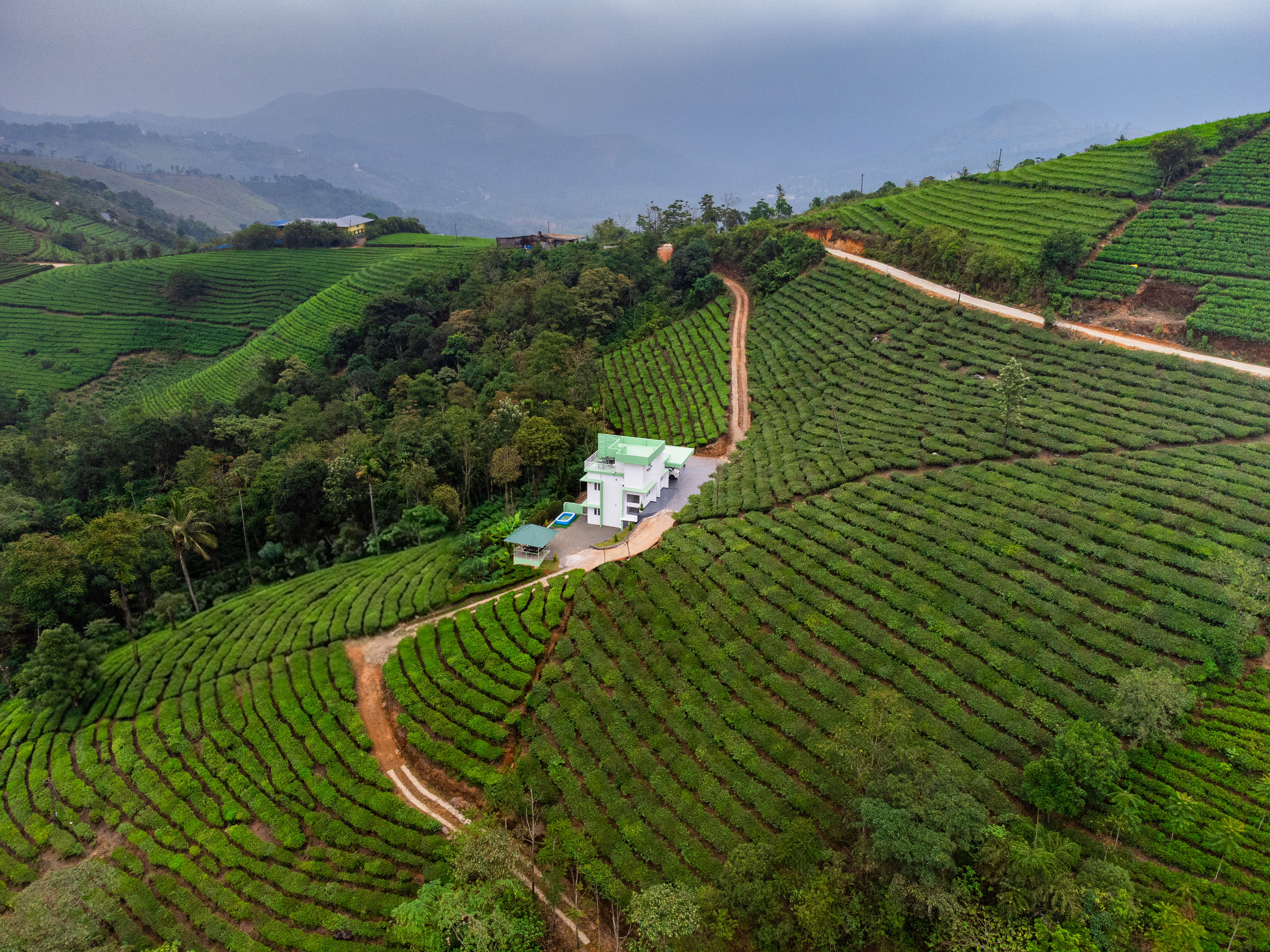 SereniTea Villa aerial view surrounded by tea plantations, Vagamon